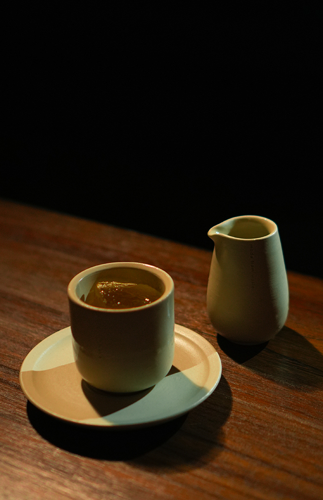 Specialty drinks in ceramic vessels at Rasa Bar Seminyak